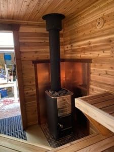 Sauna with an m3 wood burning stove in the corner