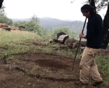 Drawing Circle In The Dirt To Build A Native American Sweat Lodge
