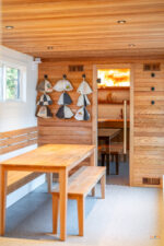 mobile spa on wheels entryway and sauna hats on display with table