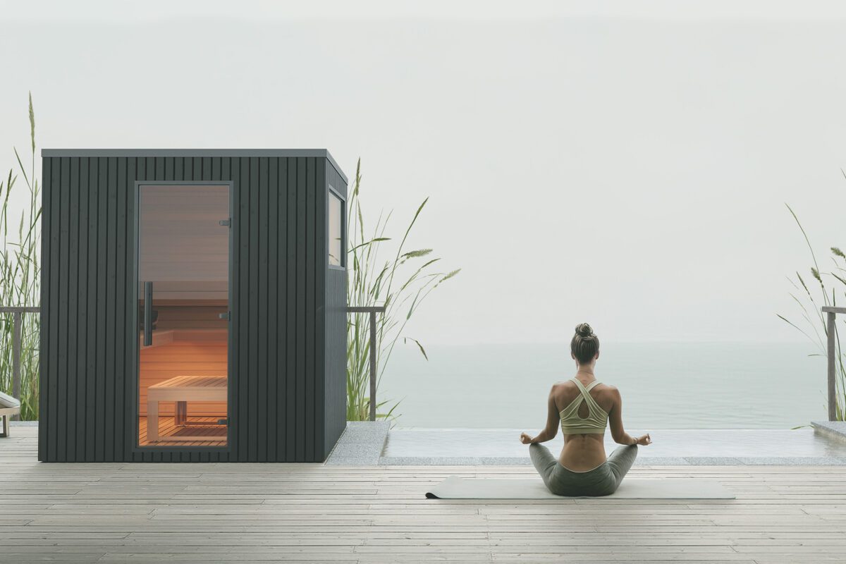 Girl Doing Yoga By An Outdoor Sauna