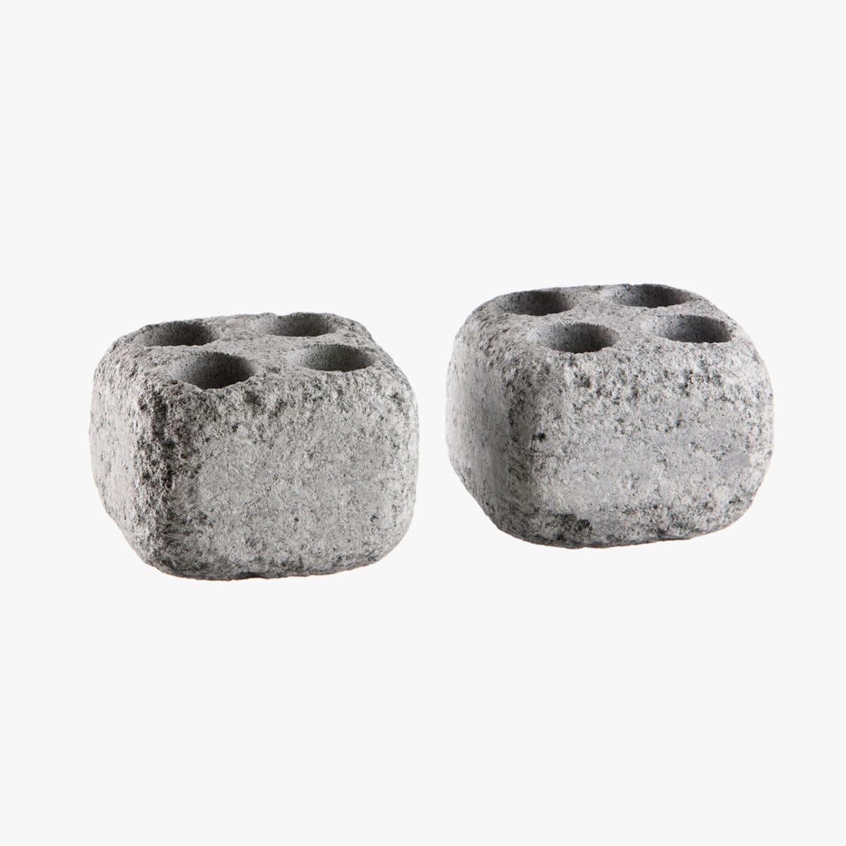 Image of 2 cube stones with 4 holes in each top