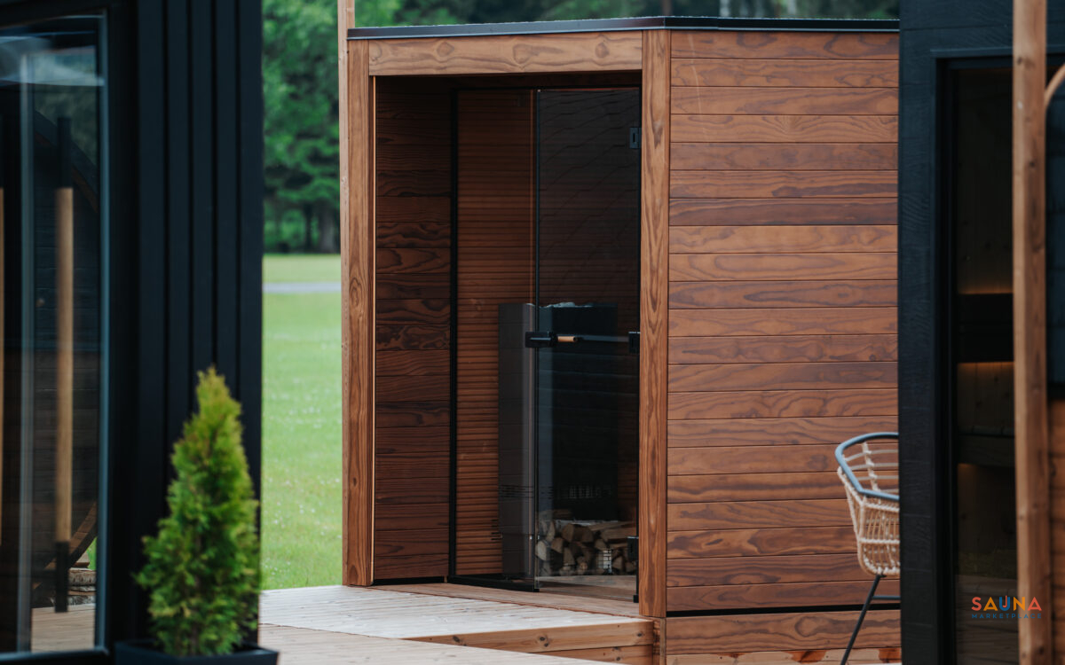 Outside Corner Of Auroom Aera Outdoor Sauna Kit With 3 Bench Levels And Overhang