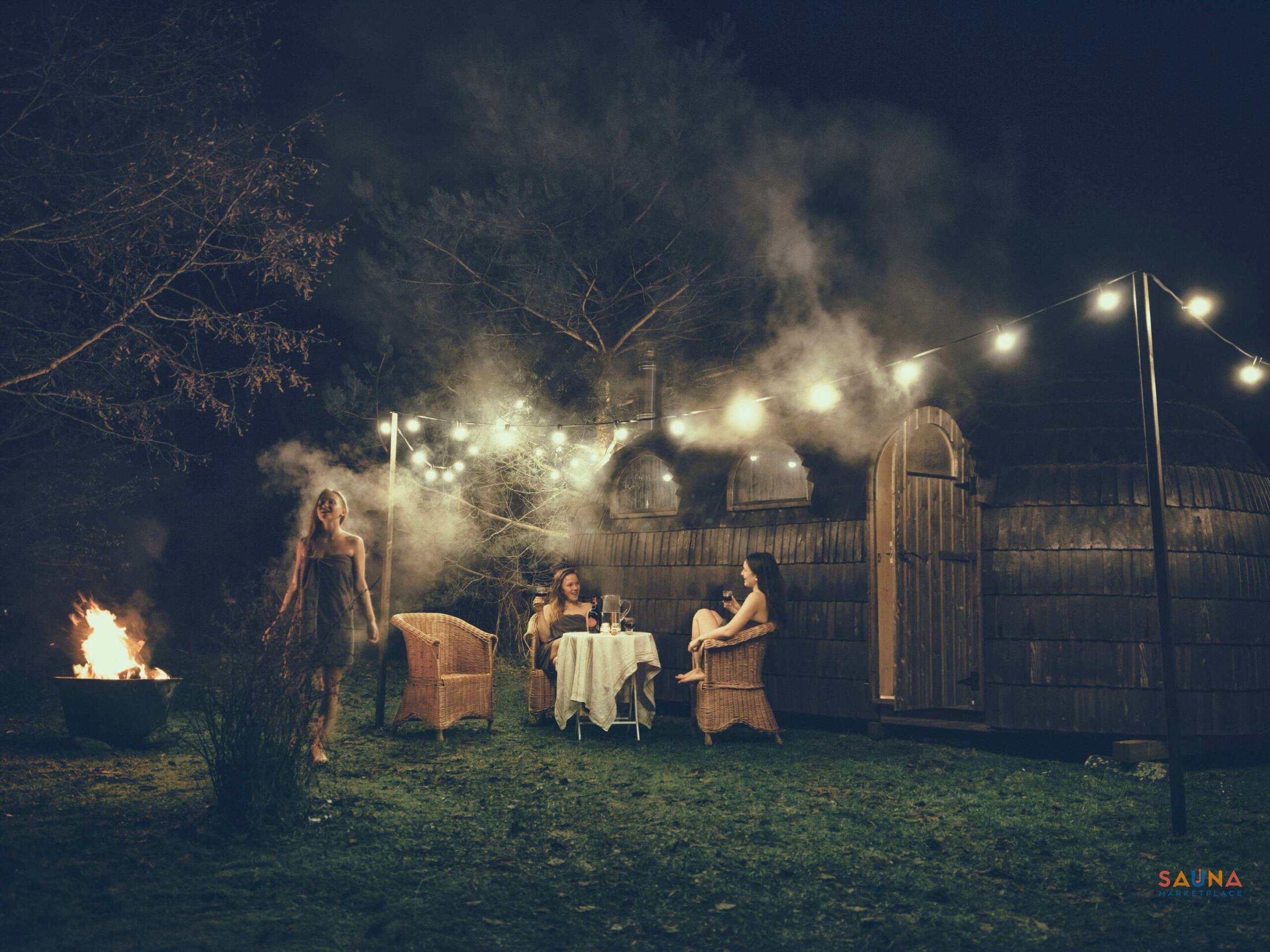 Iglucraft Triple Iglusauna at night—three-room layout glowing warm under the shingles