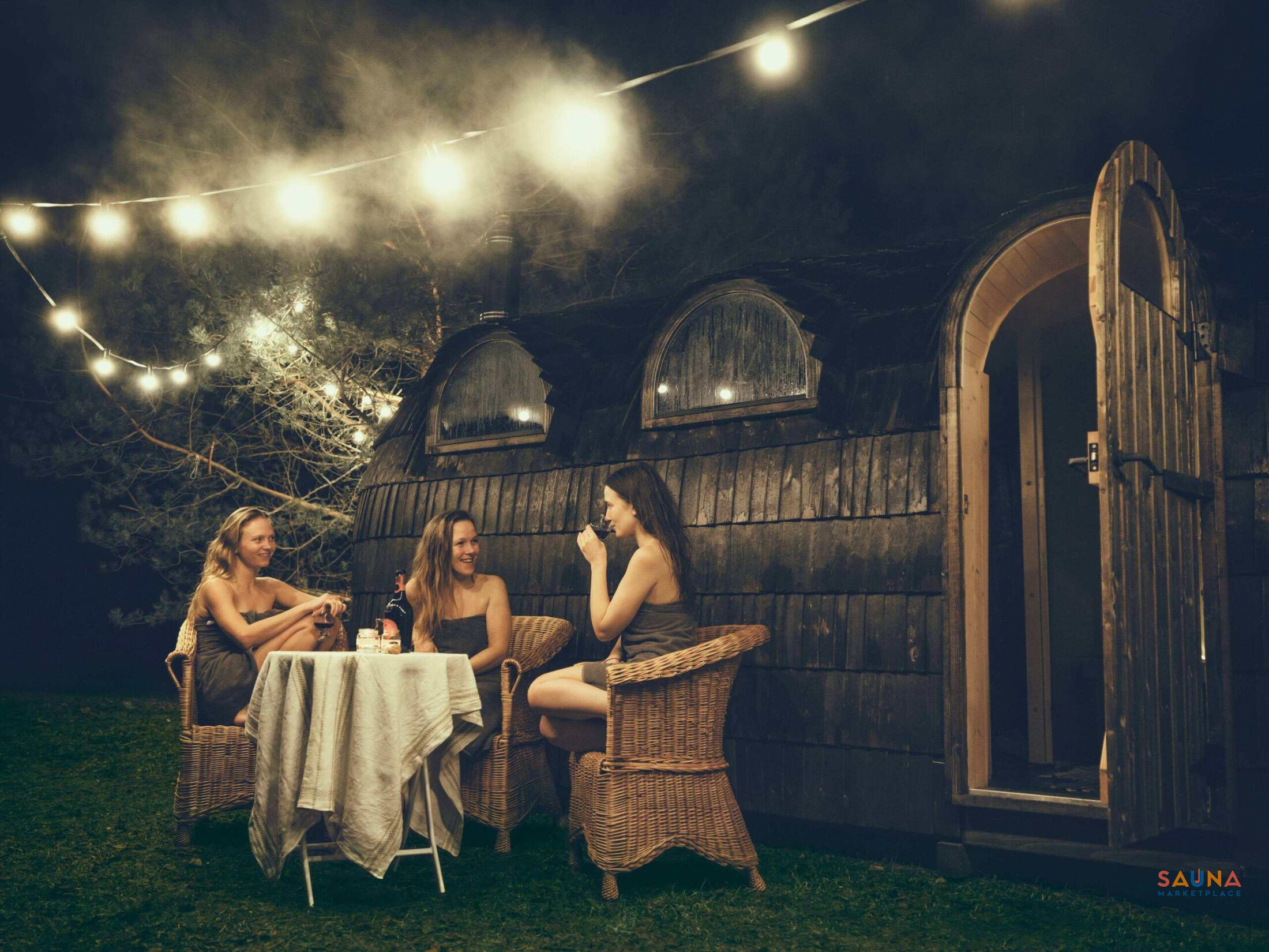 Triple Iglusauna exterior in a natural setting—gathering between rounds